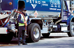 Petro service tech in front of propane truck