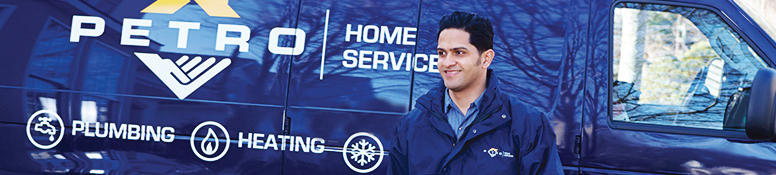 petro home services employee in front of a truck